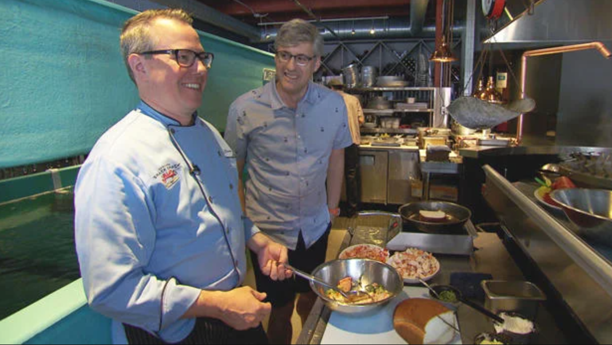 Smack Shack owner Josh Thoma in the Smack Shack Food truck with journalist Mo Rocca